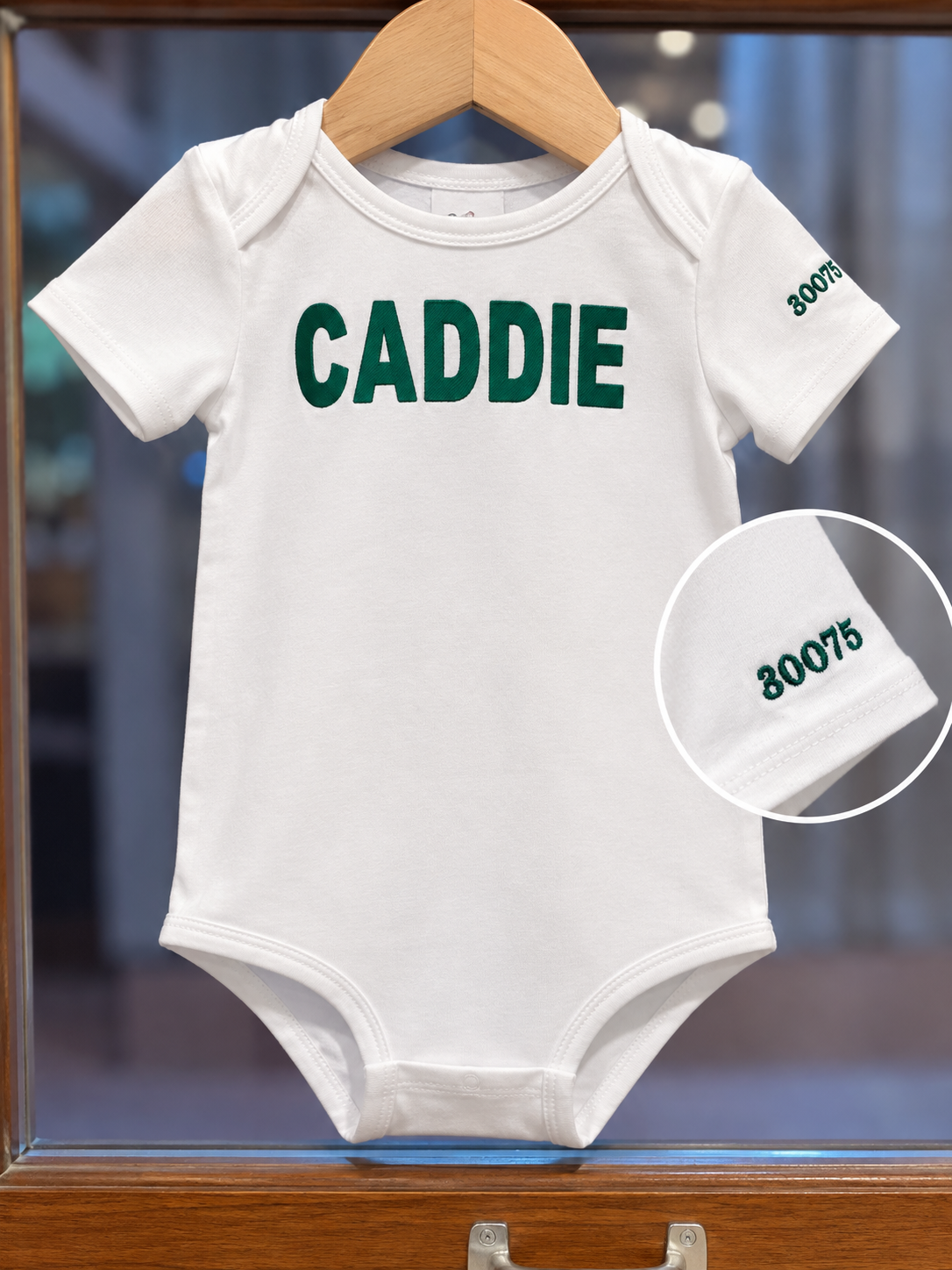 Bits & Bows Caddie Onesie with Custom Roswell Embroidery on sleeve